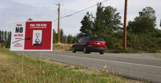 An anti-PUD sign sits along Bayview Road on Tuesday
