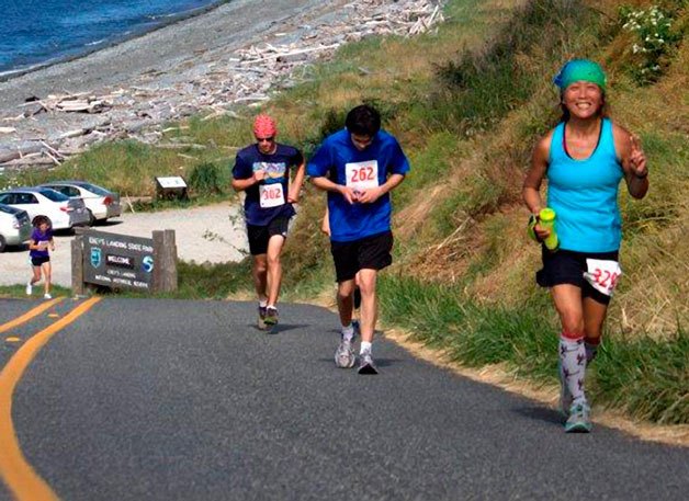 Runners come up Hill Road near Ebey’s Landing during the 2012 Race the Reserve. Several distances are offered for the fundraiser which helps pay for Coupeville High School’s graduation party.