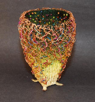 Marilyn Moore’s wire and mixed media work called “Confetti” is featured in MUSEO’s fiber exhibit for May.