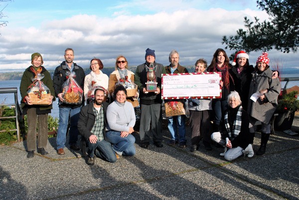 All the winners of the Langley Chamber of Commerce’s Very Merry Christmas Giveaway and the Langley Main Street Association’s Deck the Doors contest celebrate together with a quick photo. From left to right