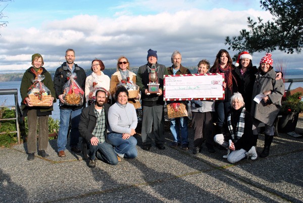All the winners of the Langley Chamber of Commerce’s Very Merry Christmas Giveaway and the Langley Main Street Association’s Deck the Doors contest celebrate together with a quick photo. From left to right