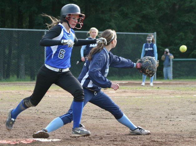 Falcon sophomore Haley Viers beats the throw to first base during the second game of a doubleheader against Sultan on Friday at South Whidbey High School.