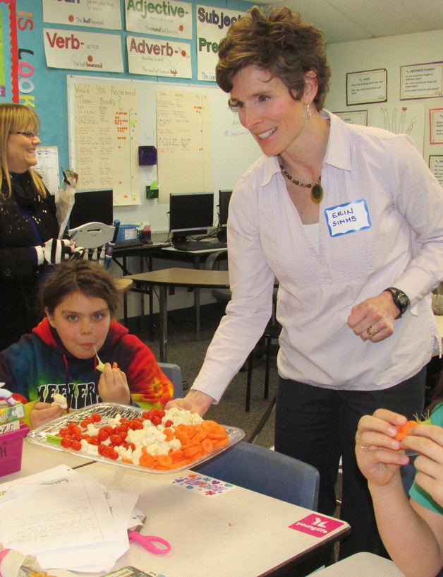 Erin Simms feeds Laura Langer some ”brains and bones”  disguised as cauliflower