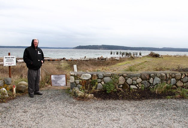 Mike McVay poses for a picture in front of a wall accross the end of Wonn Road in Greenbank
