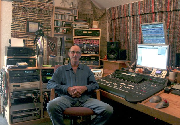 Blue Ewe Studios owner David Malony sits on his throne: the chair inside his control room. Malony’s studio is built inside a wooden cabin in the Freeland woods.