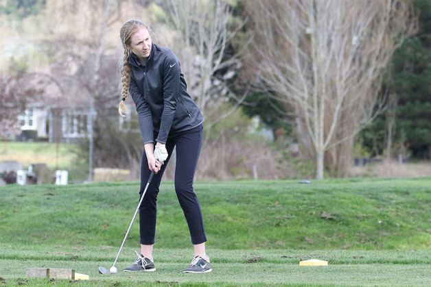 South Whidbey sophomore golfer Kolby Heggenes lines up a shot at the Whidbey Shootout March 22. Heggenes scored 26 points for the Falcons during their home match against King’s