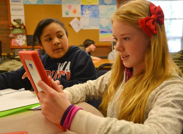Jadi McCullum and Gavriel Ewart work on materials for the Youth in Philanthropy class. The class is seeking applications for a $13
