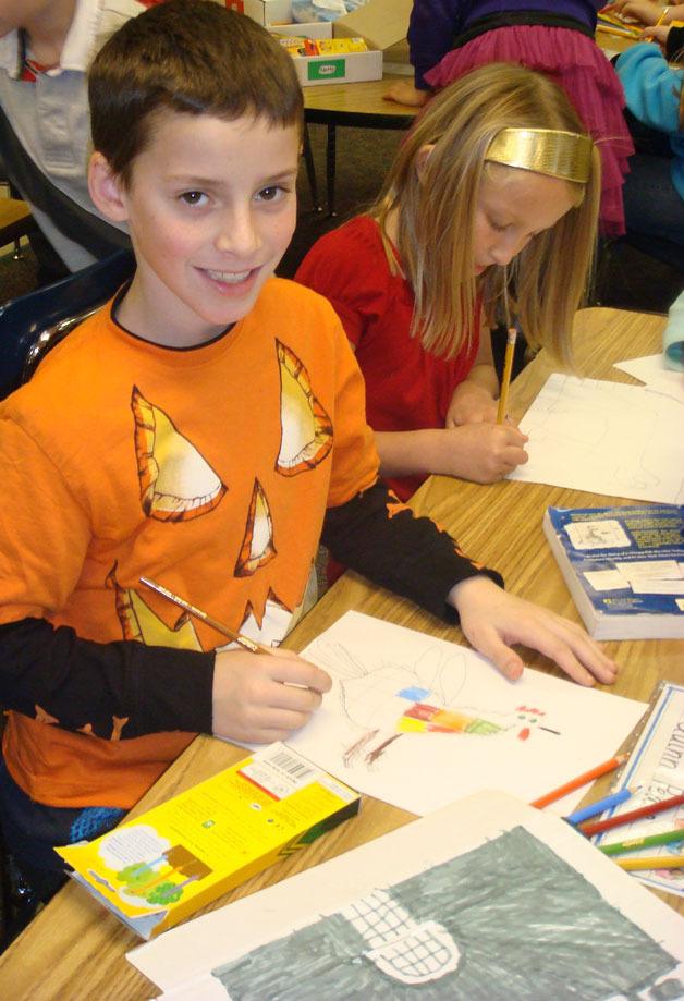 Quinn Pease and Laila Gmerek work on drawing projects in Kathy Stanley’s mulit-age classroom at South Whidbey Elementary School.