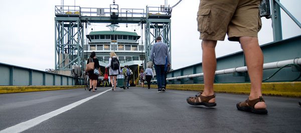 Commuters board the Tokitae in Clinton on Thursday morning. The Clinton Community Council is planning to discuss an effort to lobby for a second 144-car ferry on the route and the addition of overhead loading during a meeting later this month.