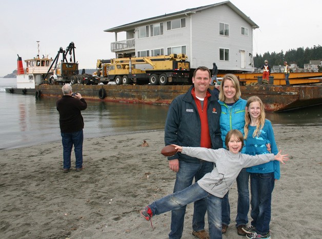 With their summer home floating in the background in Mutiny Bay