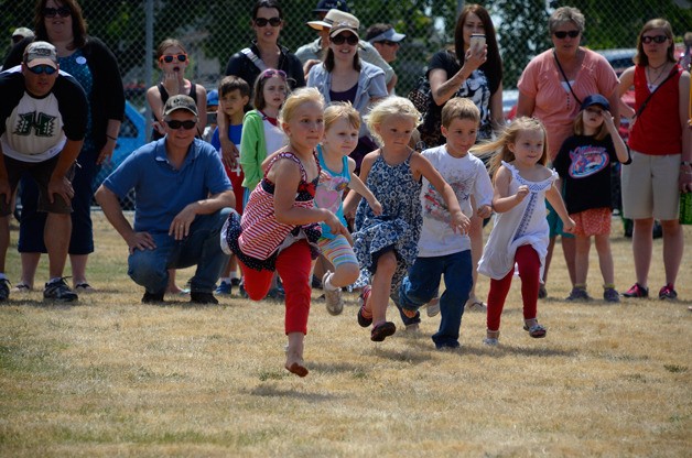 These young speedsters take off toward the finish line in the 3 & younger sprint races at the 99th Maxwelton Independence Day field games on July 4 at Dave Mackie Park.