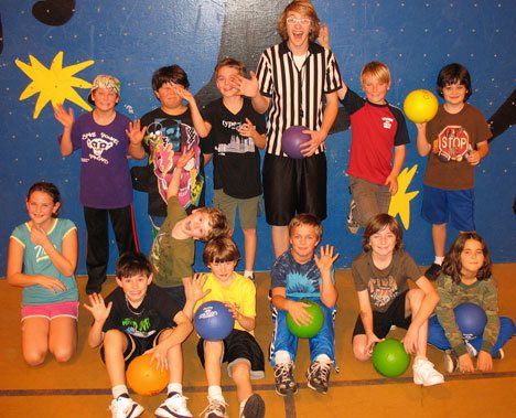 Dodgeball referee Trevor Hein is surrounded by his players Tuesday in the “cooler” at Langley Middle School.