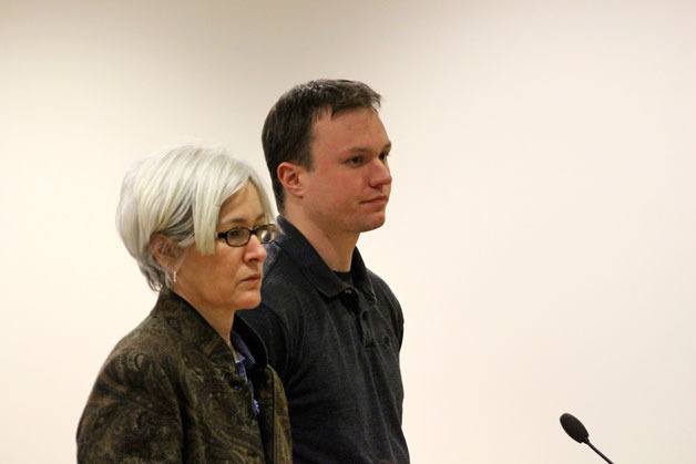 Dylan G. Jefferies stands in court with lawyer Jennifer Bouwens. Jefferies pleaded not guilty to 17 counts of possession of depictions of minors engaged in sexually explicit conduct.