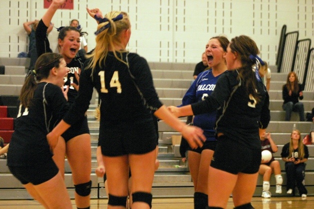 South Whidbey celebrates after winning the fifth set against Cedarcrest. Pictured are Hannah Calderwood