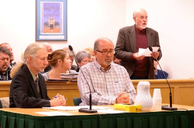 Langley Mayor Larry Kwarsick listens as City Councilman Jim Sundberg