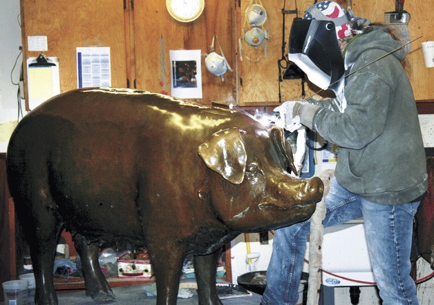 Virginia Keck welds the crack that opened above Rachel’s left ear during the sculpture's collision with a Seattle taxi.