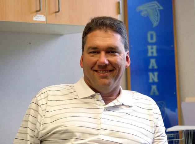 Kelly Kirk settles into his office at South Whidbey High School as the new athletic director. His main goal this year is to increase activities participation by students.