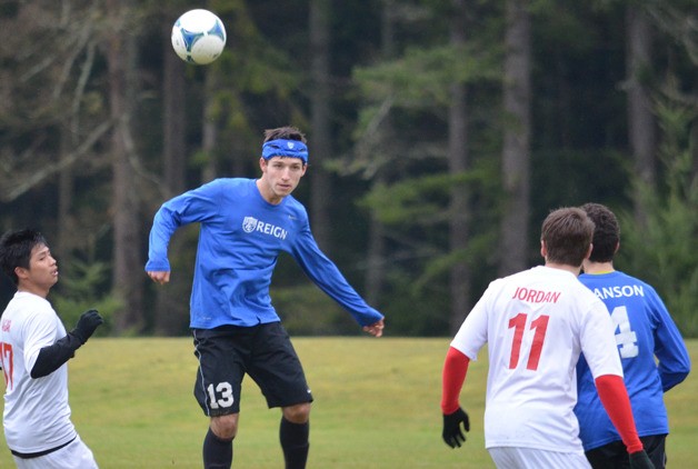 Bryce Auburn heads the ball against a team from Tukwila-Skyway in the U-17/18 playoffs Sunday