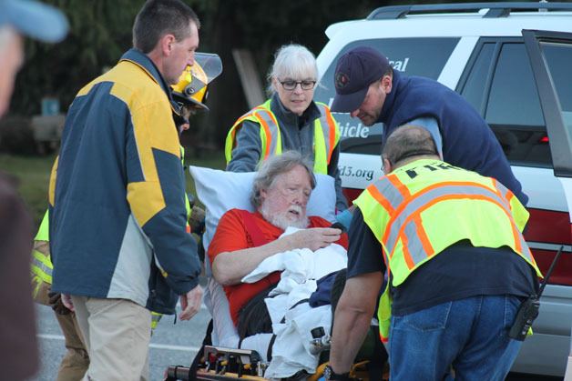 South Whidbey Fire/EMS personnel tend to a South Whidbey School District bus driver who crashed into an oncoming truck on Highway 525 near Bob Galbreath Road in Clinton on Thursday. The driver had an unknown medical emergency and had to stop in the turn lane of the highway.