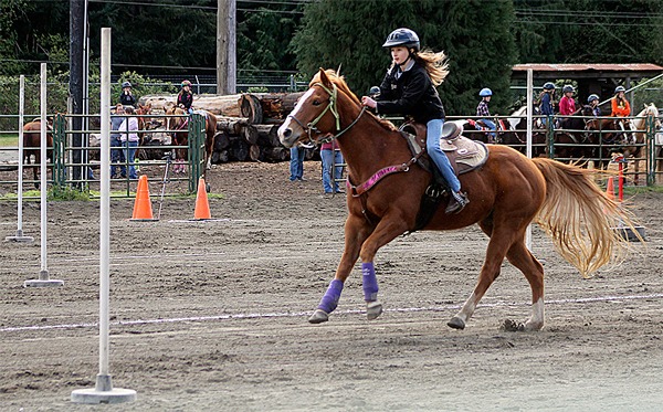 Kailey Ziss rides during the junior division pole racing event April 12 at the Island County Fairgrounds.