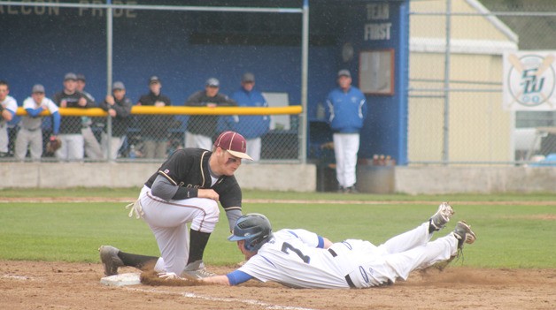 South Whidbey senior Campbell Albertsen is tagged out at first base against Lakewood on April 10.