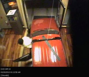 This still from security footage at Linds Jewelry shows the suspect exiting a stolen 1980 Toyota station wagon.