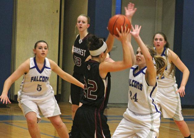 Falcon sophomore Morgan Davis pressures Cedarcrest’s Susan Kenney with help from Kacie Hanson