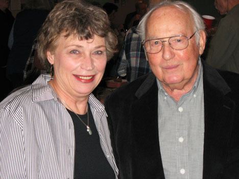 Former port commissioners Lynae Slinden and Rolf Seitle hang out together at the going-away party for Slinden Sunday in Clinton. In April