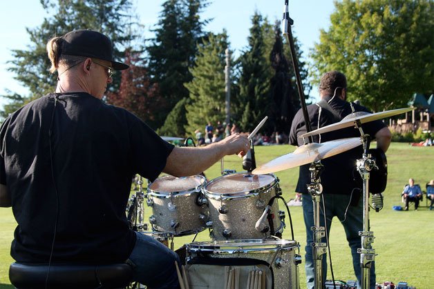 Tom Cook of Marlin James Band drums in front of a crowd of about 100 at Community Park on Wednesday evening. The concert was the opening show in the Concerts in the Park series