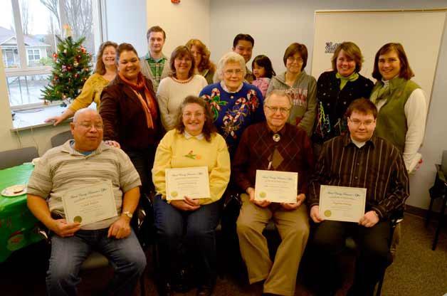 Island County Treasurer’s Office workers and elected officials pose for a picture with office volunteers who put in 190 hours of work this fall. Volunteers Lionel Peoples