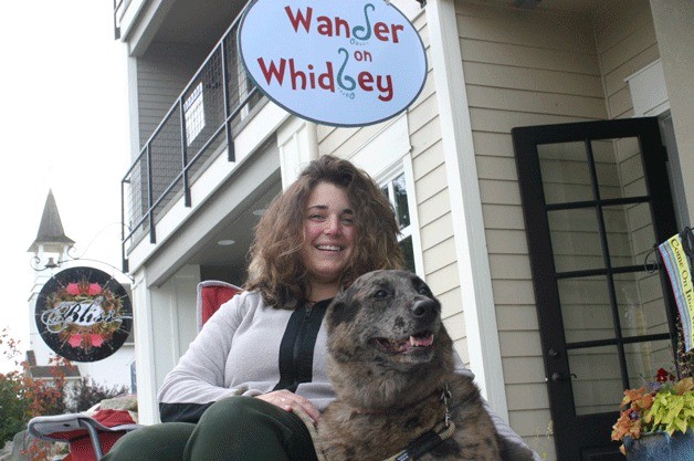 Sarah Diers and her dog Lucy outside her new shop in downtown Langley: “We’re lucky to be so  connected to the outdoors.”