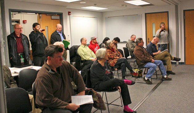 Citizens listen during a recent meeting concerning a six-month moratorium on marijuana businesses. The Commissioners adopted the temporary ban Wednesday.