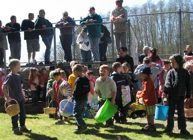 Eager kids wait for the fire horn to signal the start of last year’s Clinton Easter Egg Hunt.