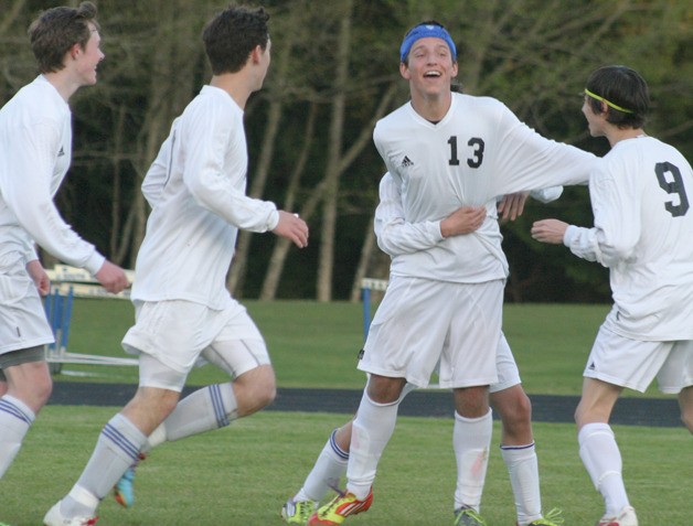 South Whidbey sophomore Bryce Auburn celebrates after scoring the go-ahead goal in the 70th minute against Coupeville on April 16. With him are