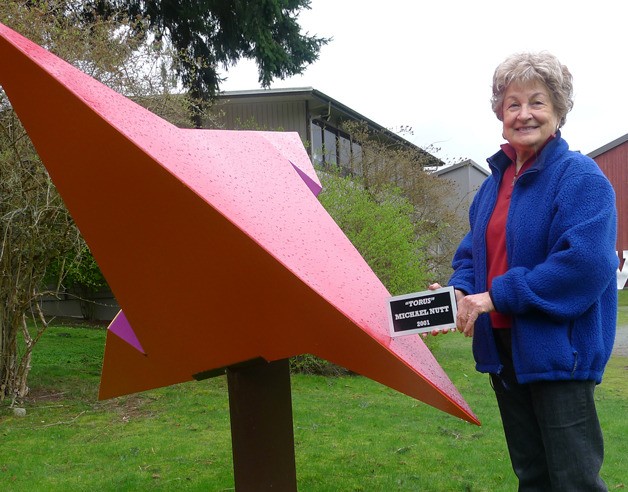 Diane Kendy stands with “Torus
