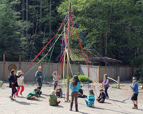 Second-graders at Whidbey Island Waldorf School practice dancing around the Maypole Thursday in preparation for Saturday's festivities.