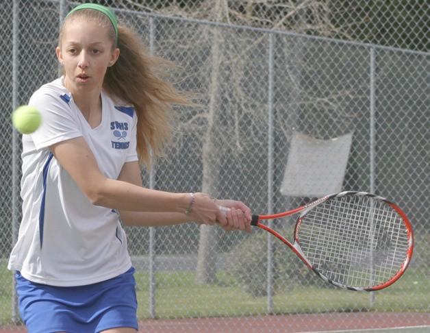 Isla Dubendorf lines up her backhand against Coupeville on April 16. She and doubles partner Hannah Calderwood won in straight sets.