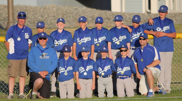 The South Whidbey Little League 11- and 12-year-old Dodgers pose for a team picture with their Andrade Tournament medals.