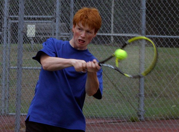 Jack Hood sends a shot across the net Tuesday in a match against Coupeville. The senior won the first singles match.