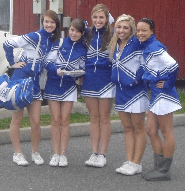 The South Whidbey cheer squad gathers for a photo outside the Roller Barn during a recent outing with foster kids.