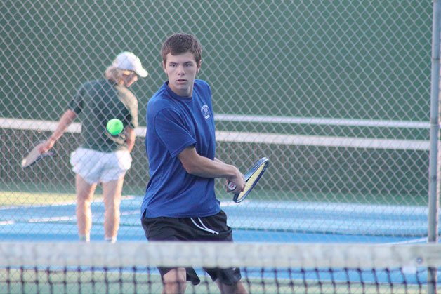 South Whidbey boys tennis junior Hank Papritz eyes an incoming volley. Papritz and his teammate Ryan Wenzek lost to their opponents from Overlake on Monday afternoon at South Whidbey High School.