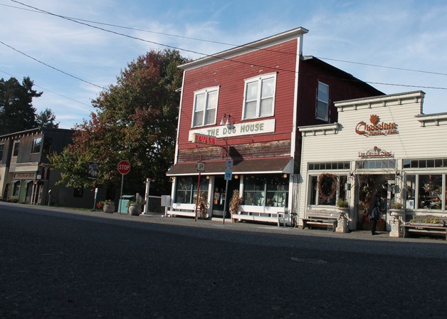 The Dog House Tavern’s street-facing windows are adorned for the fall season