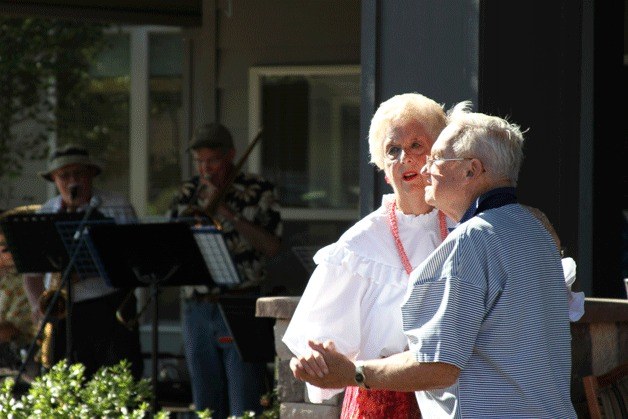 TRIPPING THE LIGHT FANTASTIC:  Grace and Harold Ojala of Langley dance at the Maple Ridge Assisted Living Community third anniversary celebration on Friday. The street dancing festival for the residents and the community featured local band Locomotion playing lots of old favorites to the delight of the dancers.
