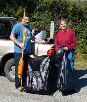 Whidbey Camano Land Trust tideland site stewards Brenda and Michael Dewey load up trash collected at Libbey Beach tidelands at a recent beach clean-up work party. Twelve volunteers picked up Styrofoam blocks and other debris from the tidelands