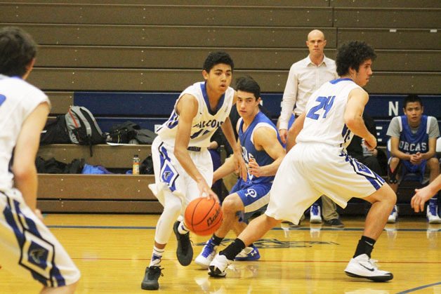 Falcon sophomore guard Lewis Pope dribbles the ball into Orcas Island’s territory on Monday night at the South Whidbey Jamboree.