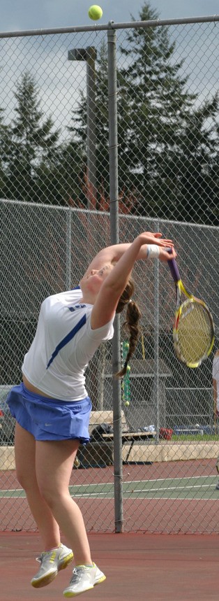 Falcon junior Amelia Weeks serves against Coupeville on April 16. Together with Tess Radisch as South Whidbey’s top doubles team