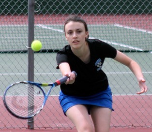 Clara Martin returns a serve in the semifinal round of the 1A District 1 girls tennis tournament. She and partner Iona Rohan won 6-0