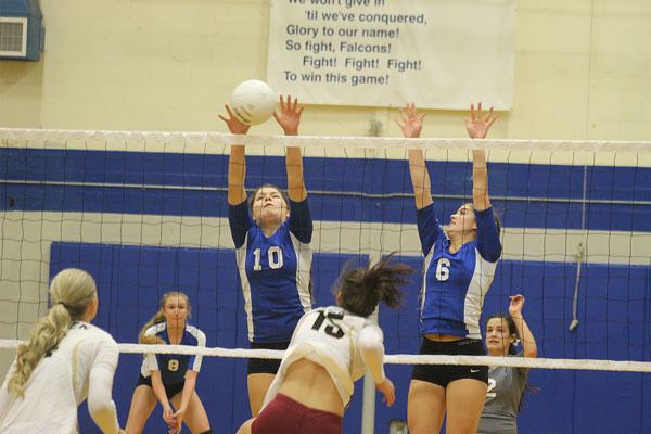 South Whidbey junior Megan Drake and senior Maryn Patterson attempt to block a kill by Lakewood’s Sidney Goodall on Senior Night on Oct. 21. The Falcons won the match