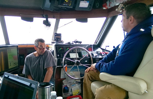 Peter Hunt chats with a diver from the Maritime Documentation Society. After 18 months