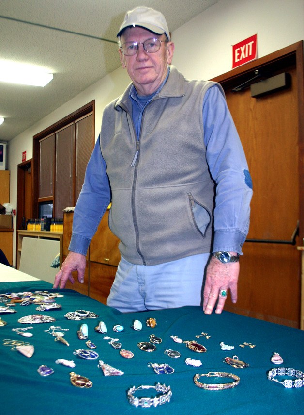 Dick James displays a number of the jewelry pieces